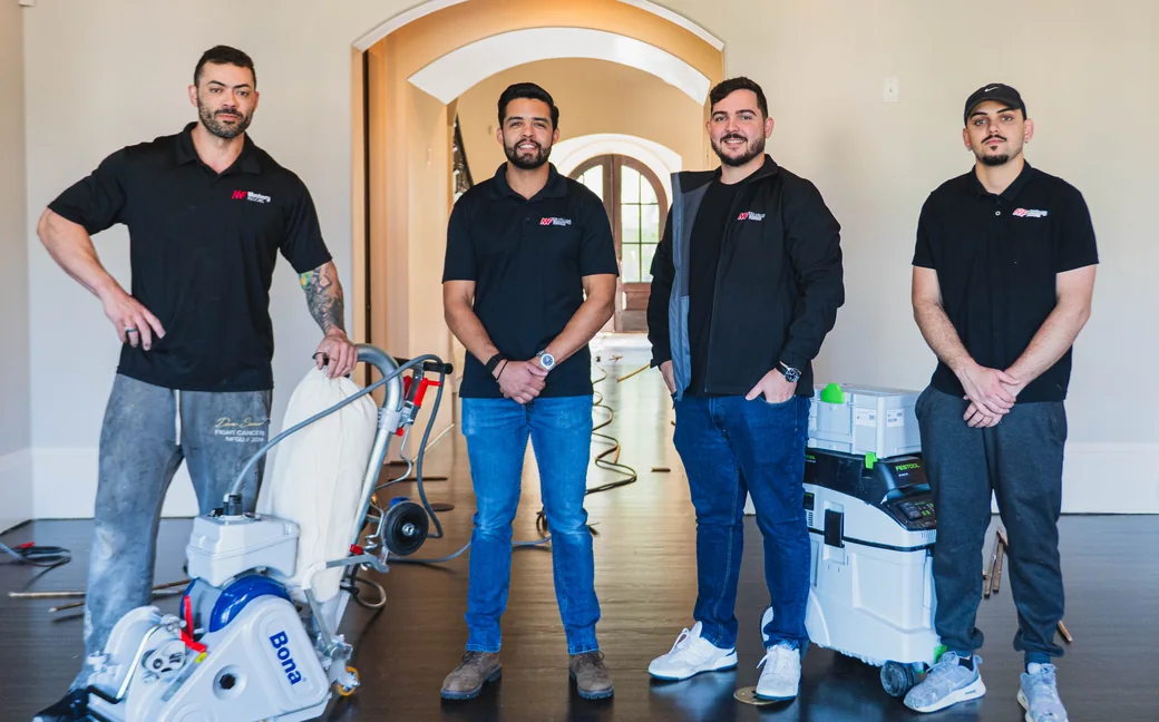 The Mastery Floors crew in a Charlotte home with their sanding equipment